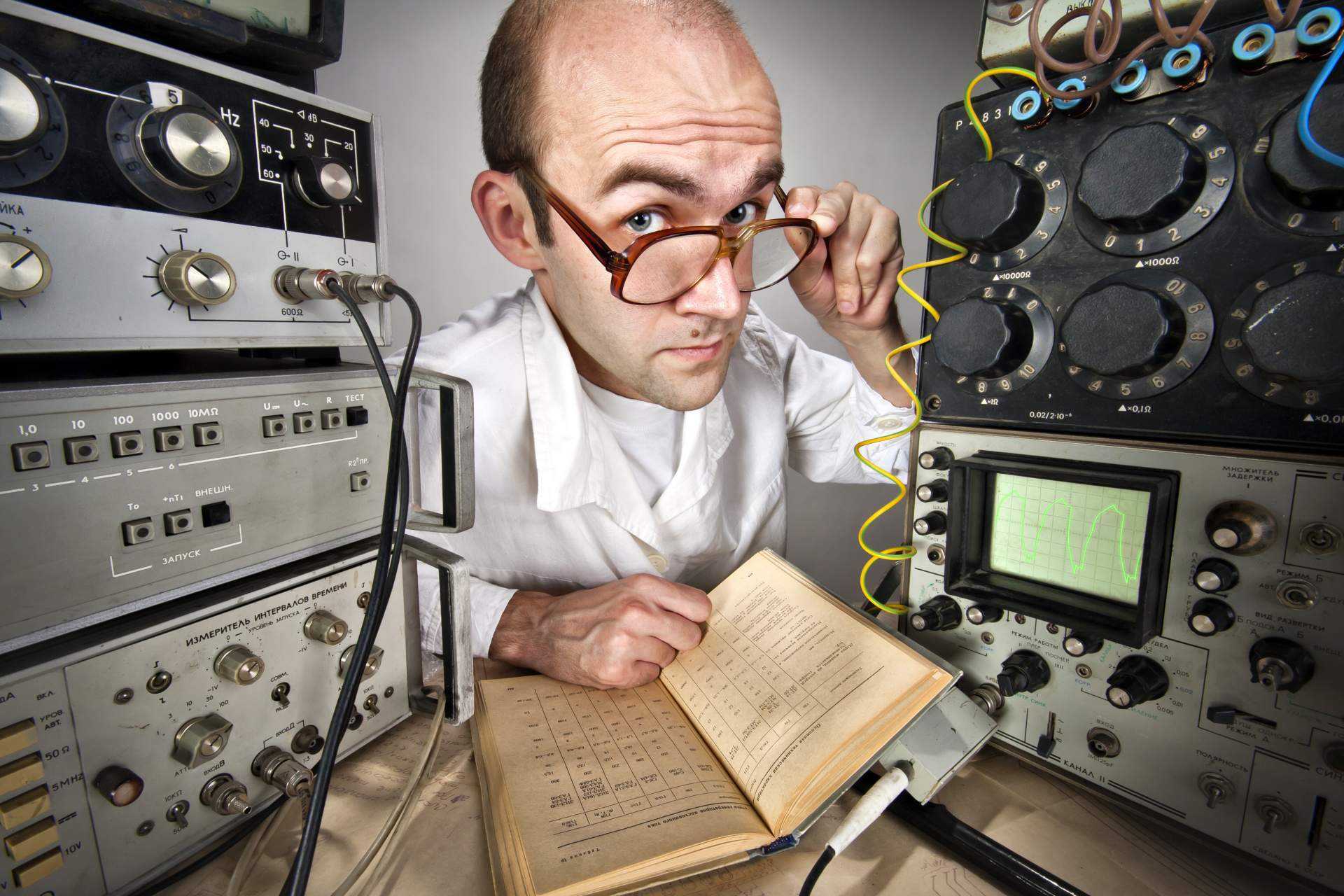 Technician with old electronic equipment.  